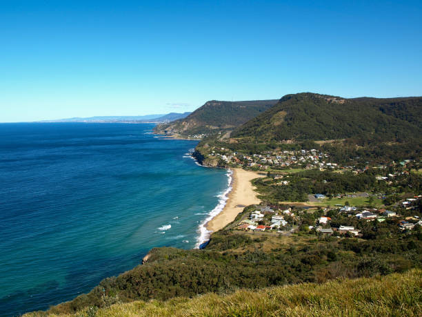 The Illawarra Looking south from the northern end of the Illawarra region of New South Wales.  Part of the route for the 2022 UCI World Road Championships is visible. The railway line between Sydney and the Illawarra is also visible. This image was taken from Stanwell Tops in late winter. uci road world championships stock pictures, royalty-free photos & images