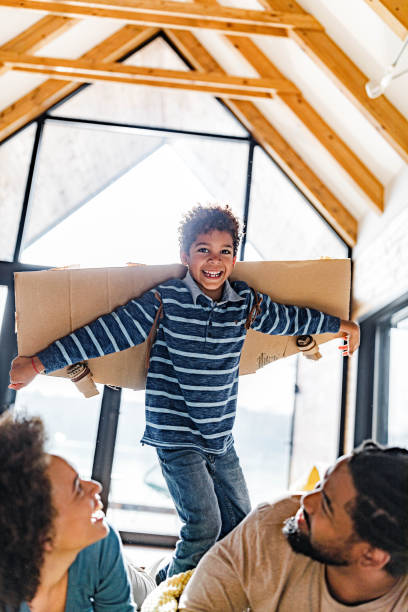 istock Mommy, daddy, I'm an airplane! 1385106269