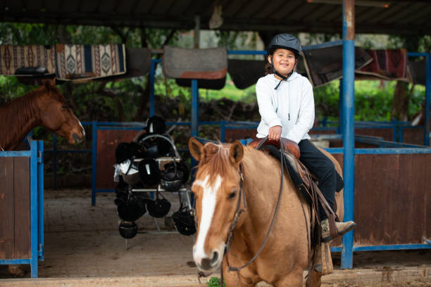 istock Kid enjoying horse ride. 1385106285
