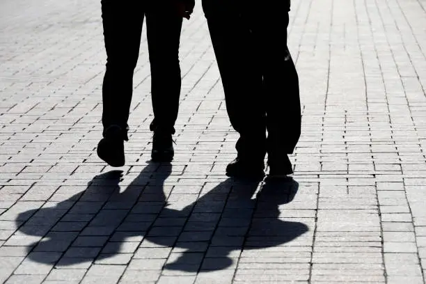 Photo of People on a sidewalk, concept of relationship, family, dramatic life story