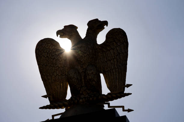 istock Silhouette of two-headed eagle against the sun 1385108083