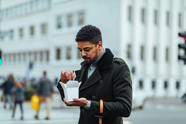 istock Man eating chinese food 1385112217