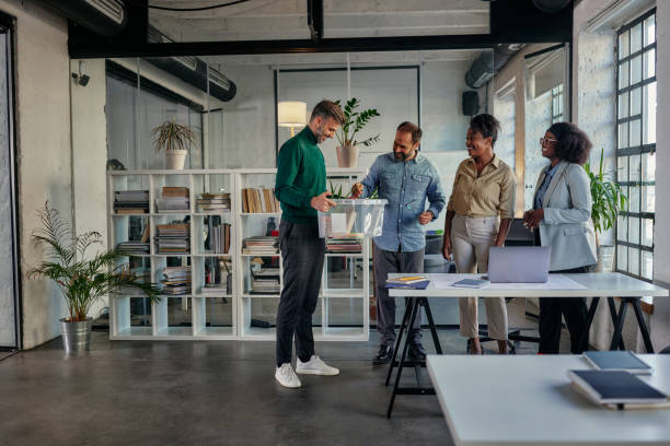 istock Coworkers greets their colleague who return to work. 1385112766