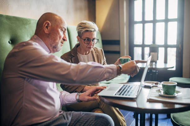 istock Business people in cafe 1385114025