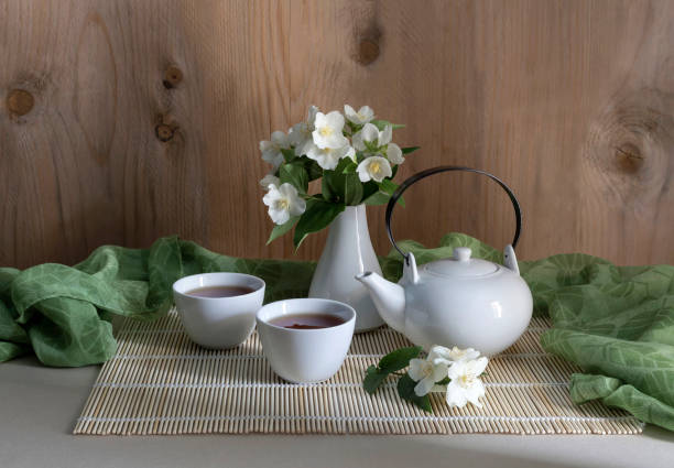 Image of Two cups and teapot for morning tea.