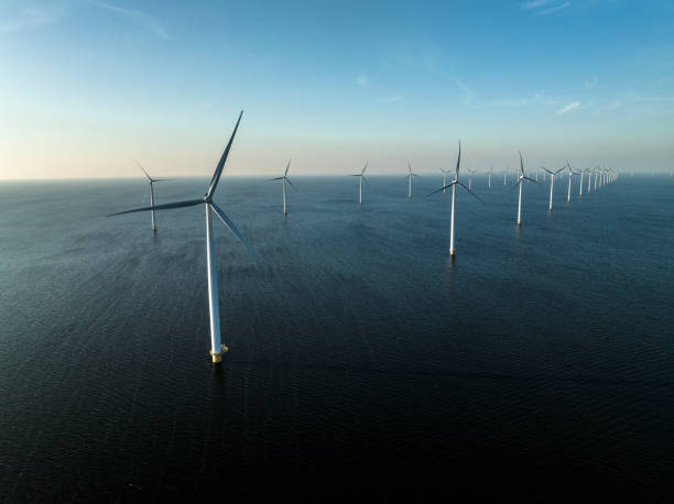 istock Wind turbines in an offshore wind park producing electricity 1385114317