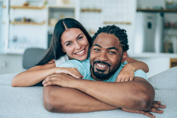 istock Couple relaxing in bedroom. 1385117910