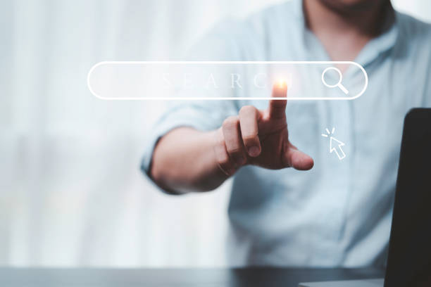 istock Hand touching with search icon for Search Engine Optimisation or SEO concept to find information by internet connection. 1385120646