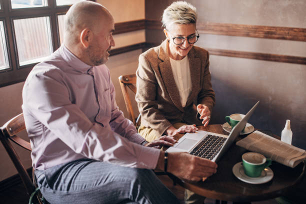 istock Business people in cafe 1385122486