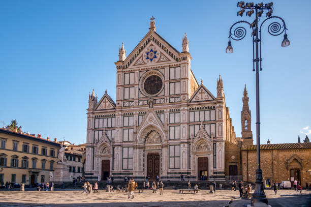 Basilica of the Holy Cross in Florence November 8, 2021 - Florence, Italy - The Basilica di Santa Croce is the principal Franciscan church in Florence, Italy located on the Piazza Di Santa Croce (Holy Cross). piazza di santa croce stock pictures, royalty-free photos & images