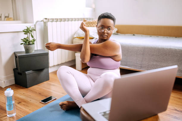 istock Online yoga session at domestic room 1385135207
