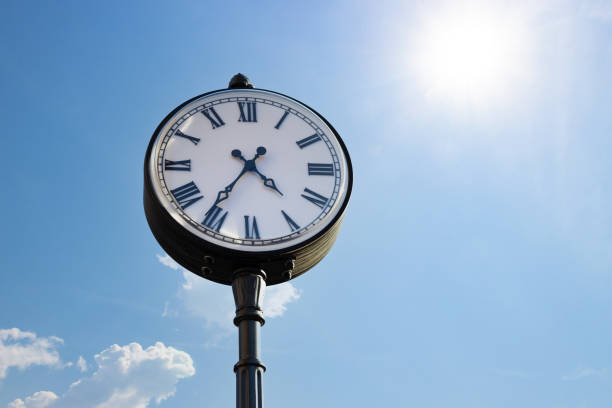 istock street clock against a blue sky 1385137531