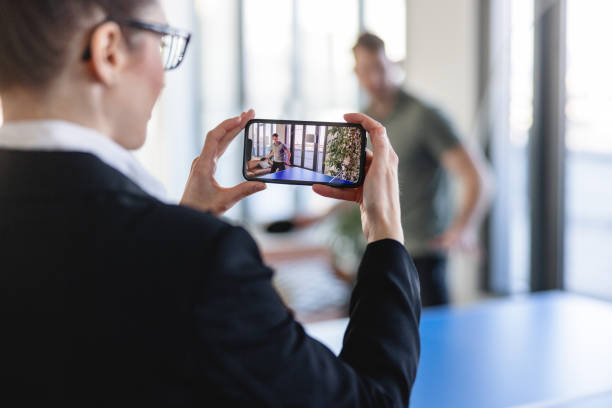 istock Caucasian Office Worker Recording An Intense Table Tennis Match 1385138543