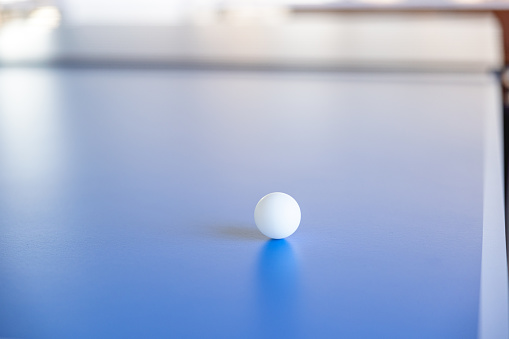 Table Tennis Ball on The Blue Table