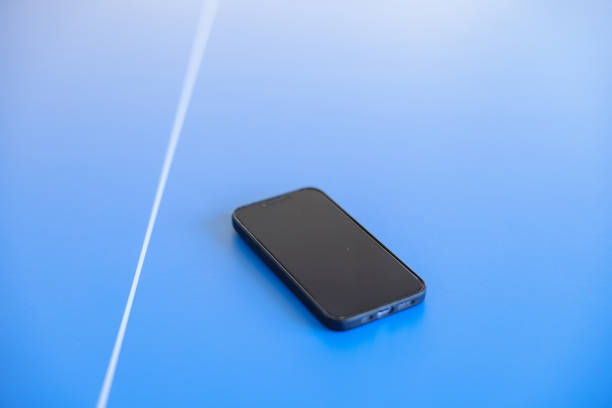 Close up of a smartphone on a tennis table stock photo