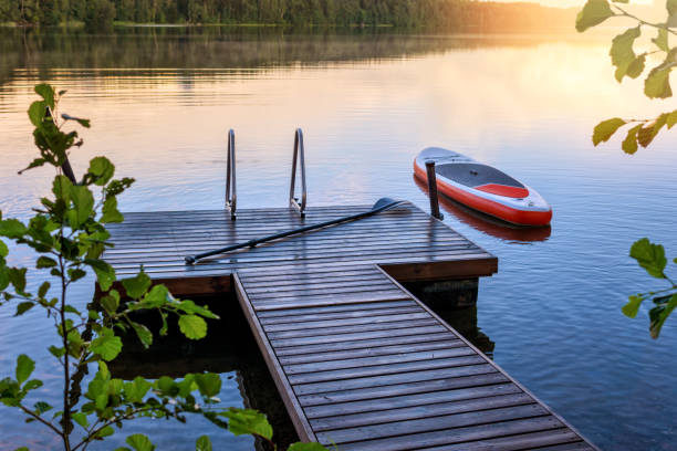 istock SUP board floating next to the wooden pier 1385147300