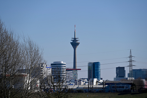 Duesseldorf, Germany, March 8, 2022 - Media harbour Duesseldorf with Rhine tower and Trivago building seen from the Rheinallee in Neuss