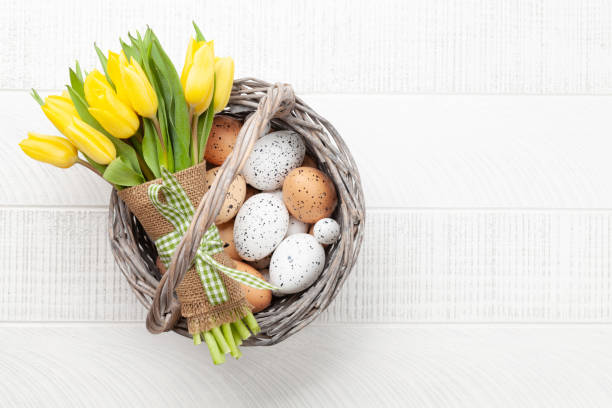 istock Easter greeting card with tulips and eggs 1385150288