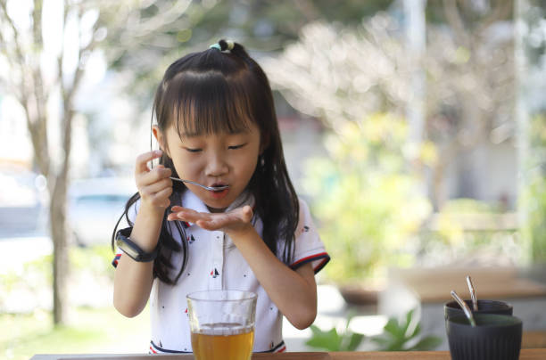istock a girl drinking in a restaurant. 1385151885