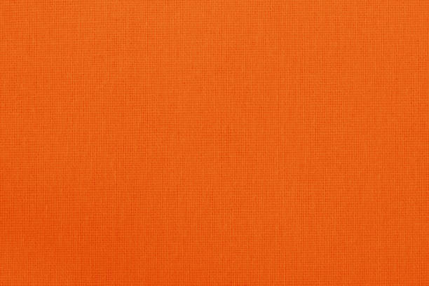 istock Orange cotton fabric texture background, seamless pattern of natural textile. 1385153708