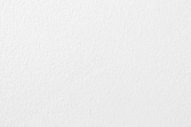 istock White grey concrete cement wall texture for background and design art work. 1385153719