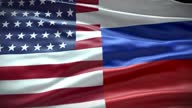 istock United States American and Russian Flag, US Russia, Washington DC, Moscow, Cold War, NATO, Warsaw Pact, Background, Full Frame, Close up, Slow motion, Smooth Waving 1385154003