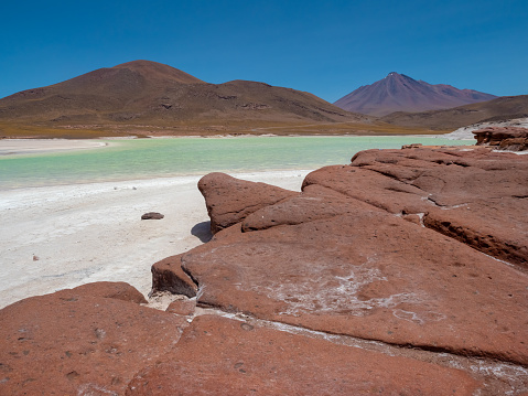 Piedras Rojas (Red Stones) a volcanic salt lagoon (4200 mts above sea level) surrounded by unqiue reddish rock formations, Atacama desert, Chile