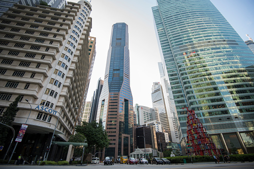 Singapore City,Singapore - September 08, 2019: Low wide-angle view looking up to modern skyscrapers in business district of Singapore City.