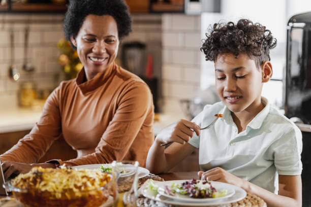 istock Lunch time with mother at home 1385159729