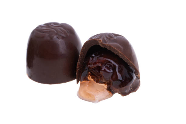 istock chocolate candies with cherries and liqueur isolated 1385164224