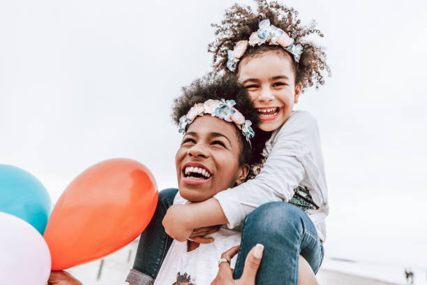 istock Happy family by the beach 1385164439