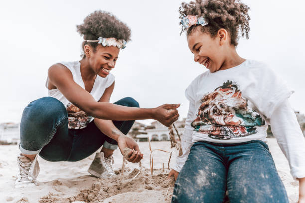 istock Happy family by the beach 1385165041