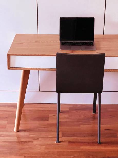 istock Vintage desk and laptop 1385165112