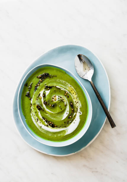 istock Green broccoli soup with coconut milk and fried hot spices on marble table 1385165675