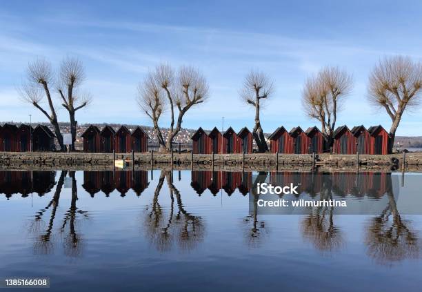 Red Boat Houses In The Harbor Of Jönköping Lake Vättern Jönköping Sweden Beautiful Reflexions In The Water Stock Photo - Download Image Now