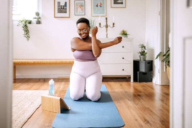 istock Woman doing yoga at home 1385168241