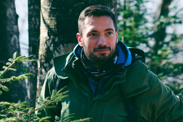 istock Man hiking pine forest in late winter 1385168352