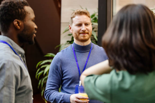 istock Multiethnic business people talk during a coffee break 1385168386