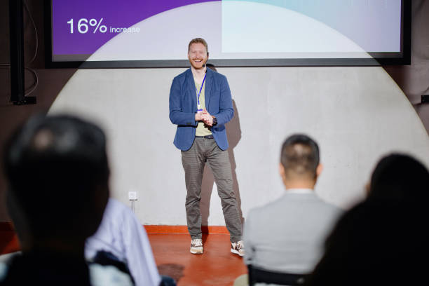 istock Visionary male speaker smiling and looking at the audience 1385168542