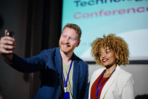 istock Key speakers taking selfie after successful presentations at the conference 1385168630