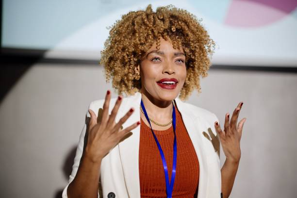 istock Close up of a visionary female speaker talks on tech conference 1385168696