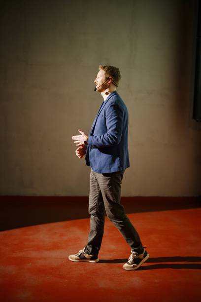 istock Public speaker giving talk at conference event. 1385168729