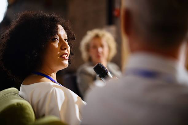 istock Close up of a female panelist sharing her own perspective on current topic 1385168783