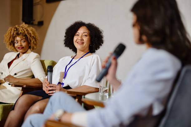 A panel of experts participate in a Q&A breakout session during a business conference.
