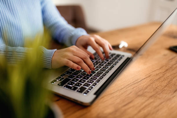 istock Woman typing on laptop 1385168808