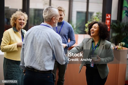 istock Business people greet each other during a coffee break at a conference 1385170533
