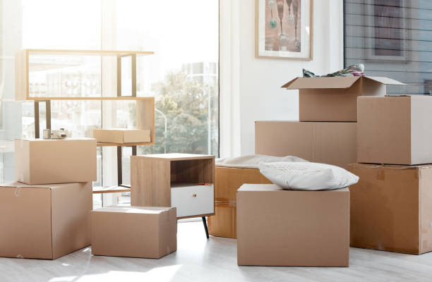 istock Shot of boxes in a new and empty home during the day 1385170748