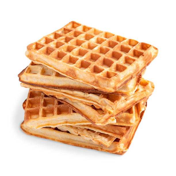 istock Stack of golden belgium waffles served for breakfast isolated on white background 1385170871