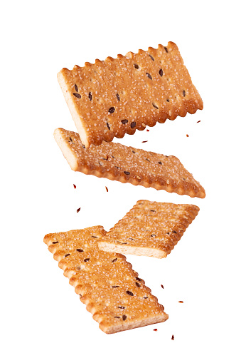 sweet crunchy cookie flying on white background