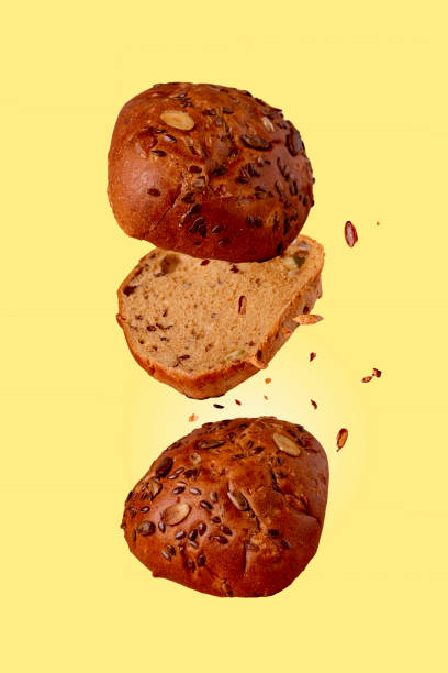 istock bread with sunflower seeds flying on a yellow background 1385175289